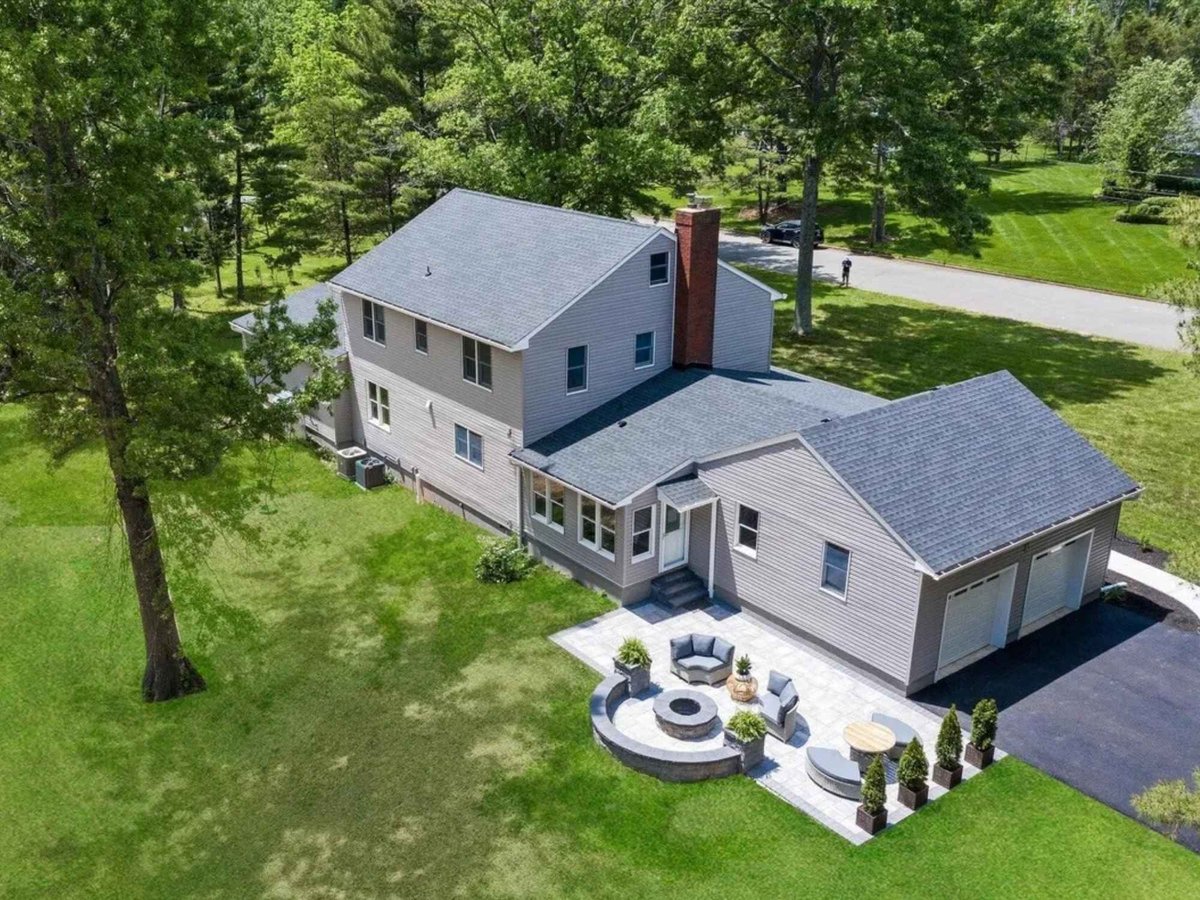 aerial view of house exterior with patio and two car garage in a houghton contracting custom home project in trenton new jersey
