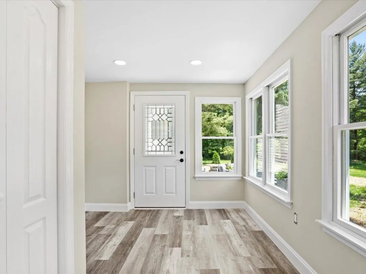 entry foyer with glass paneled door and large windows in a houghton contracting custom home project in trenton new jersey