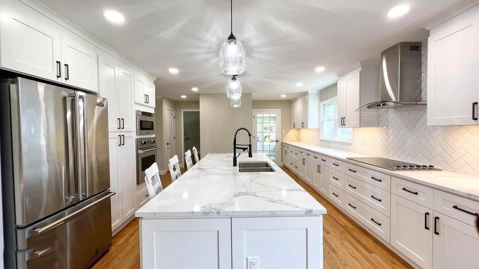 kitchen with island and black cabinet hardware in a houghton contracting custom home project in trenton new jersey