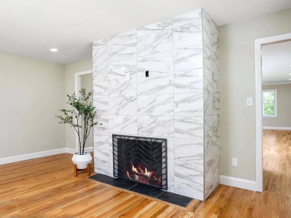 living room with marble tile fireplace surround in a houghton contracting custom home project in trenton new jersey