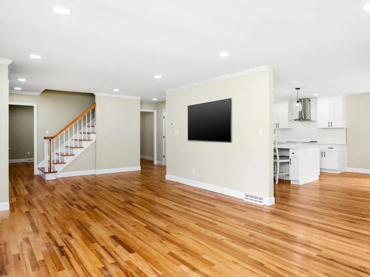 open concept living room with kitchen view in a houghton contracting custom home project in trenton new jersey