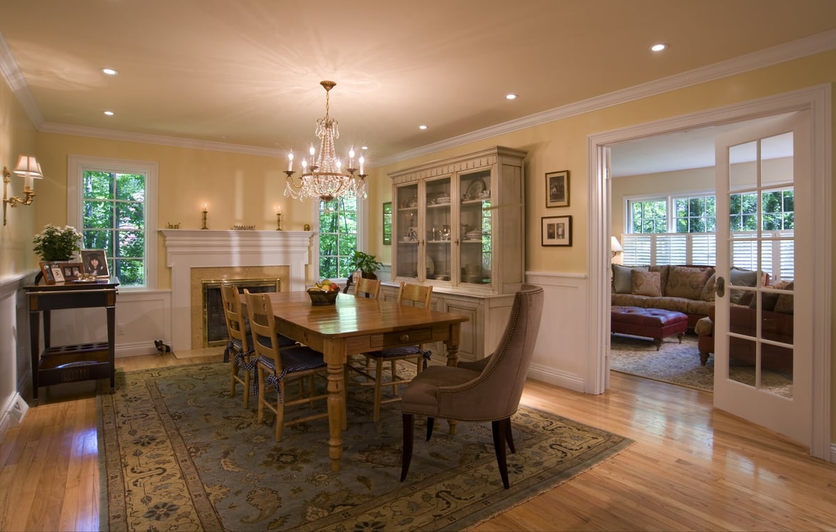 dining room with lighted china cabinet and french doors to living room houghton contracting custom home project in west windsor new jersey - optimized