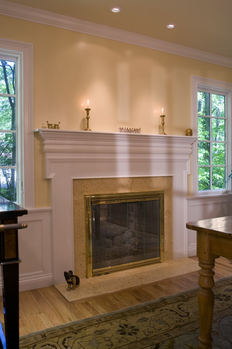 white mantel fireplace with marble surround and brass doors houghton contracting custom home project in west windsor new jersey - optimzed