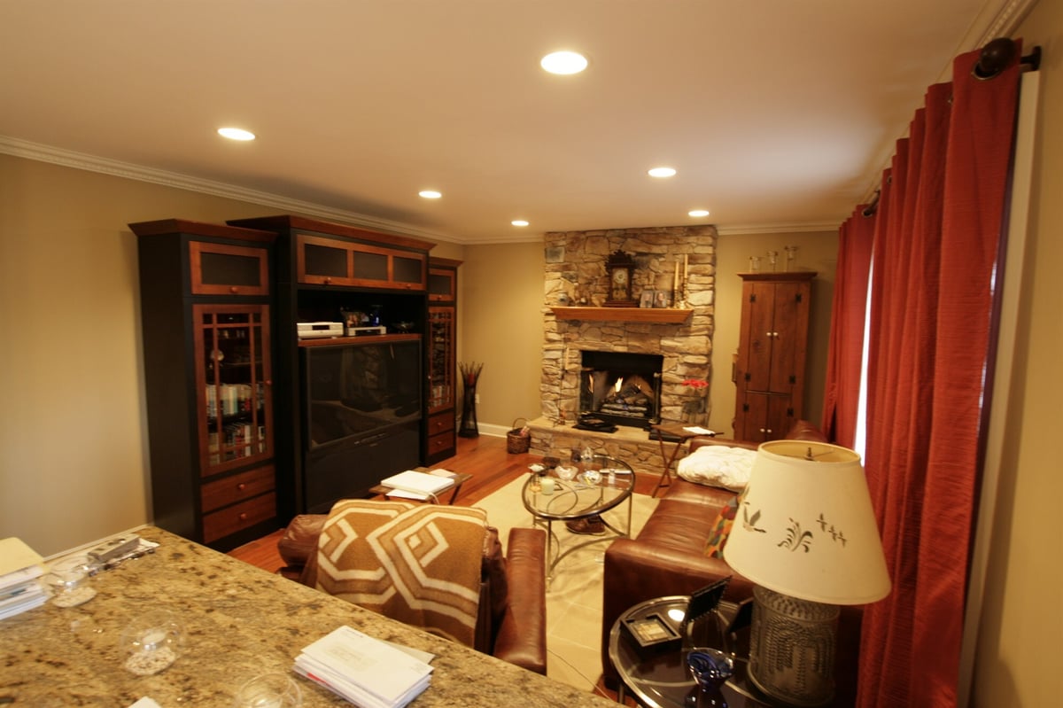 cozy family room with stone fireplace and leather sectional houghton contracting custom home project in newtown pa-optimized