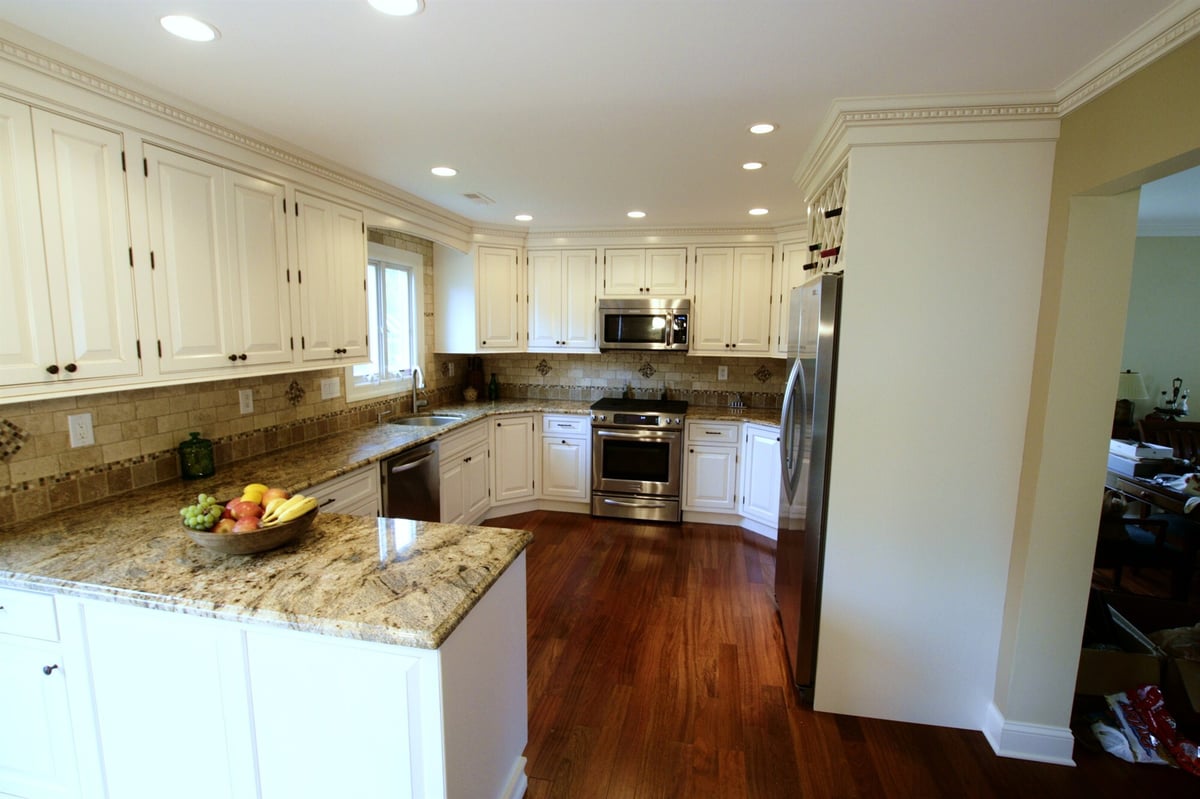 kitchen with breakfast seating and sink beneath window houghton contracting custom home project in newtown pa-optimized
