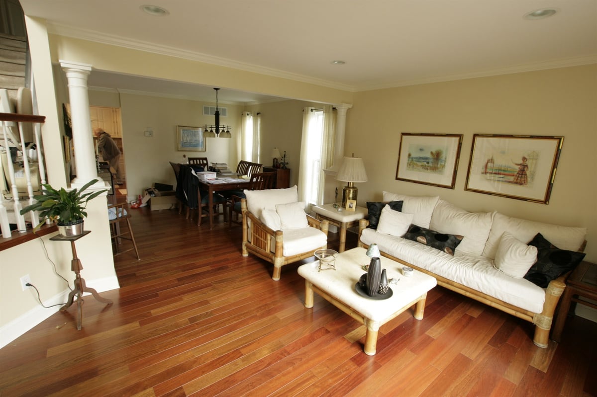 open living and dining room with decorative columns custom home project by houghton contracting in newtown pa-optimized