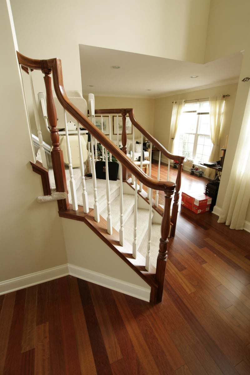 staircase with wood railing and stair lift houghton contracting custom home project in newtown pa-optimized