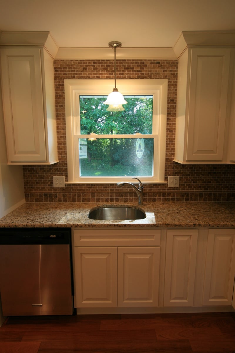 kitchen sink and window with stainless dishwasher and granite countertop custom home project by houghton contracting in ewing new jersey