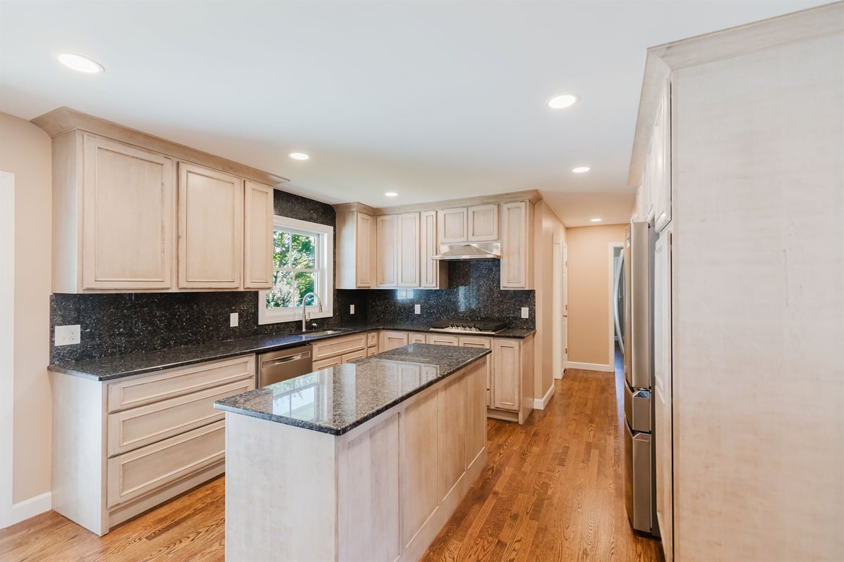 maple kitchen with island black granite counters and sink window home addition project by houghton contracting in lawrenceville new jersey-optimized