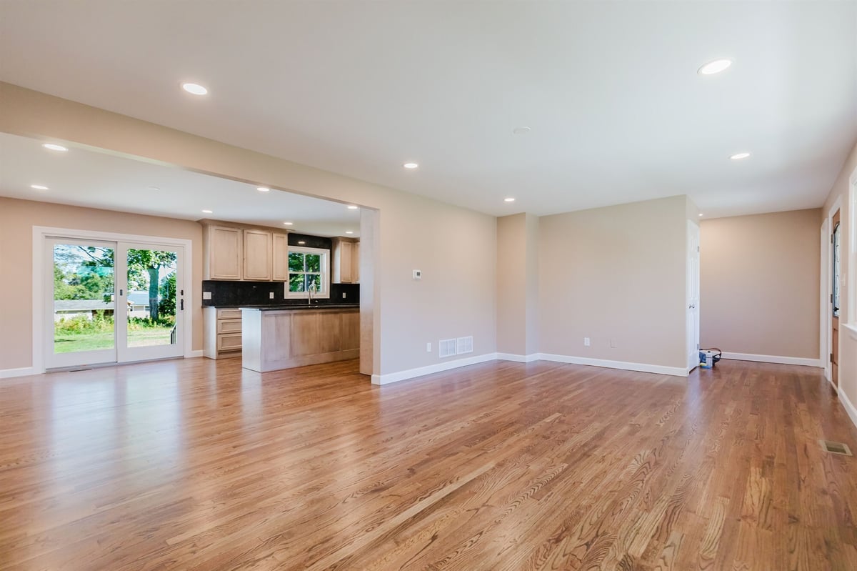 open living room and kitchen with sliding patio door home addition project by houghton contracting in lawrenceville new jersey-optimized
