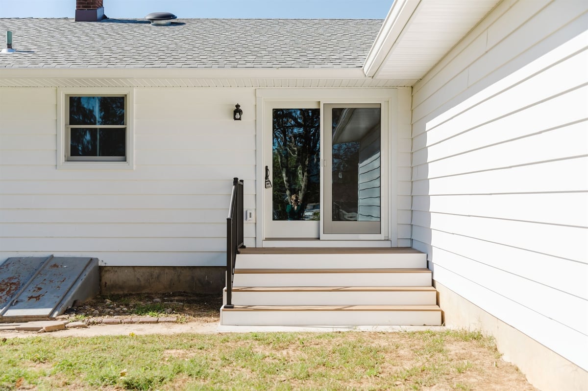 rear entry door with composite deck steps home addition project by houghton contracting in lawrenceville new jersey-optimized