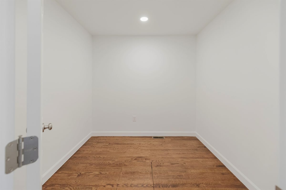 small bonus room with recessed light and hardwood floor home addition project by houghton contracting in lawrenceville new jersey-optimized