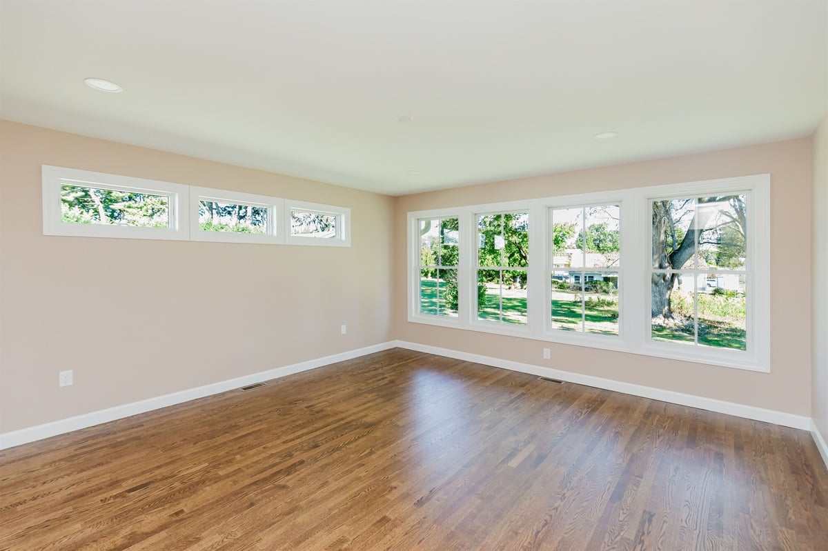 sunroom interior with transom windows and hardwood floors home addition project by houghton contracting in lawrenceville new jersey-optimized