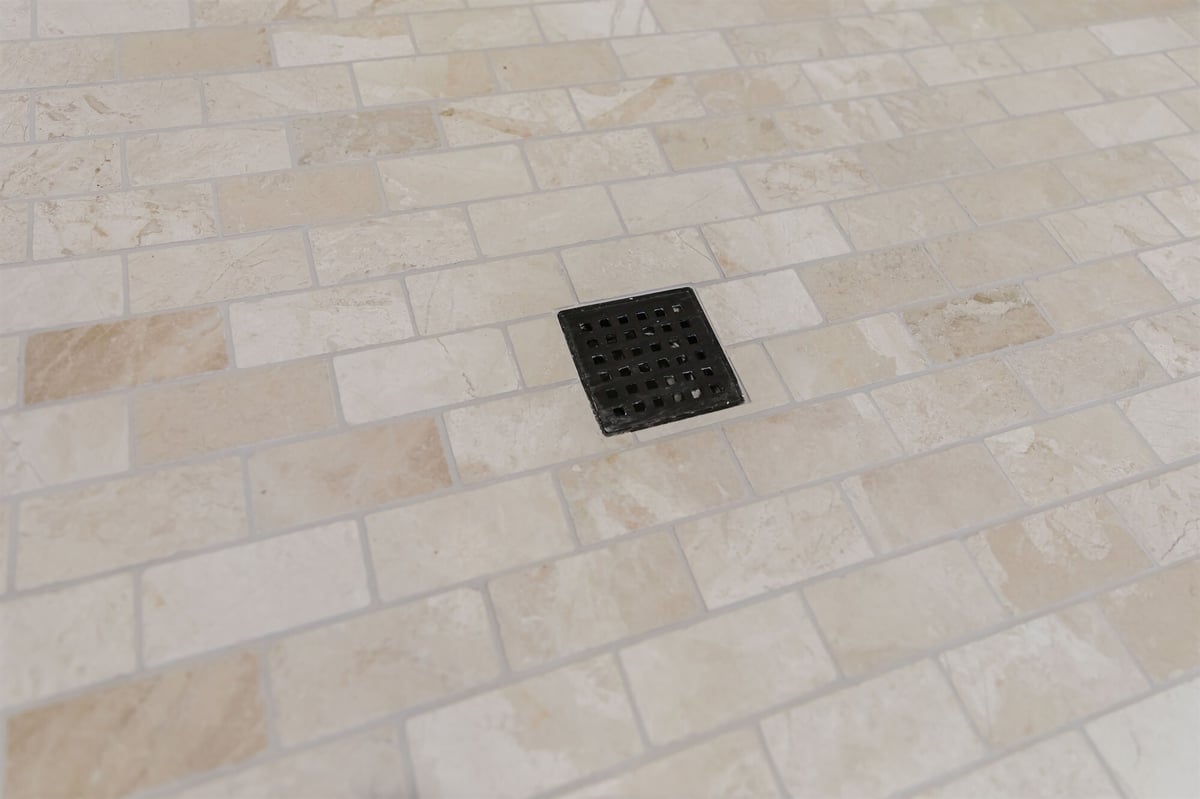 travertine mosaic shower floor with black square drain home addition project by houghton contracting in lawrenceville new jersey-optimized