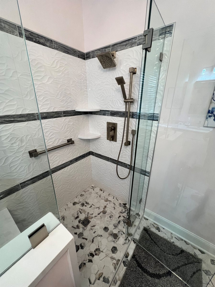 corner walk in shower with wave tile and hexagon mosaic floor master bathroom remodel by houghton contracting in columbus new jersey-optimized