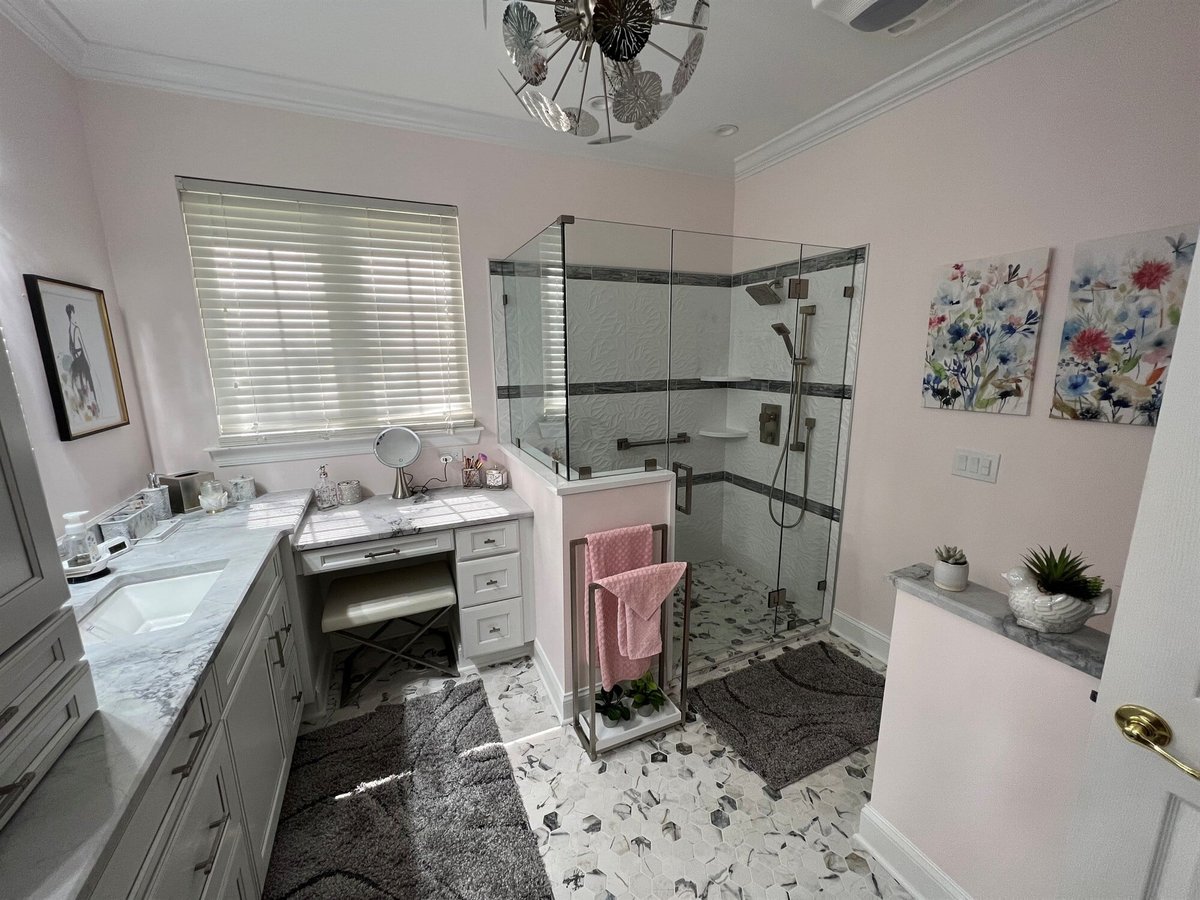 marble top vanity with makeup desk and corner glass shower master bathroom remodel by houghton contracting in columbus new jersey-optimized