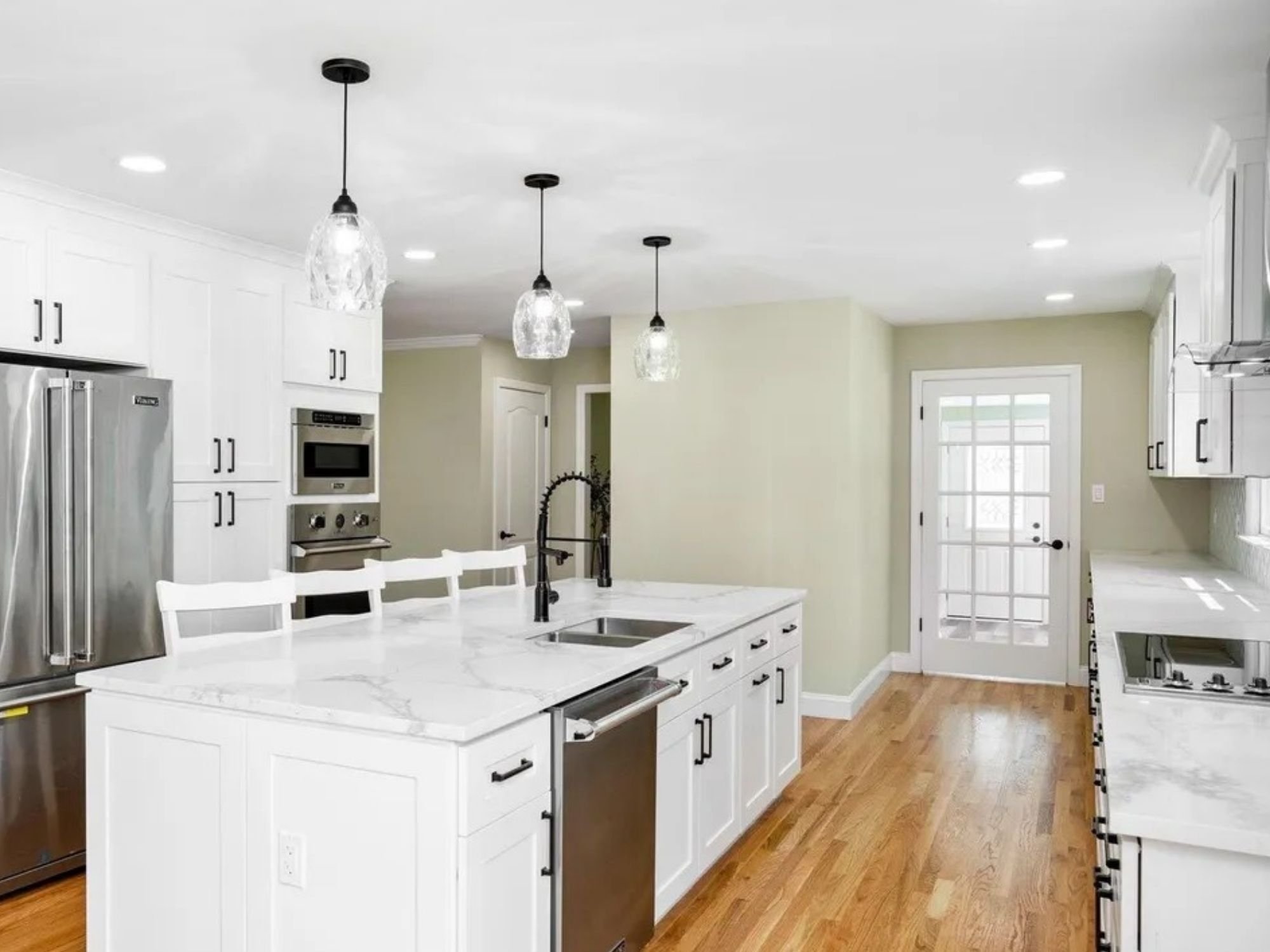 kitchen with stainless steel appliances and pendant lighting in a houghton contracting custom home project in trenton new jersey