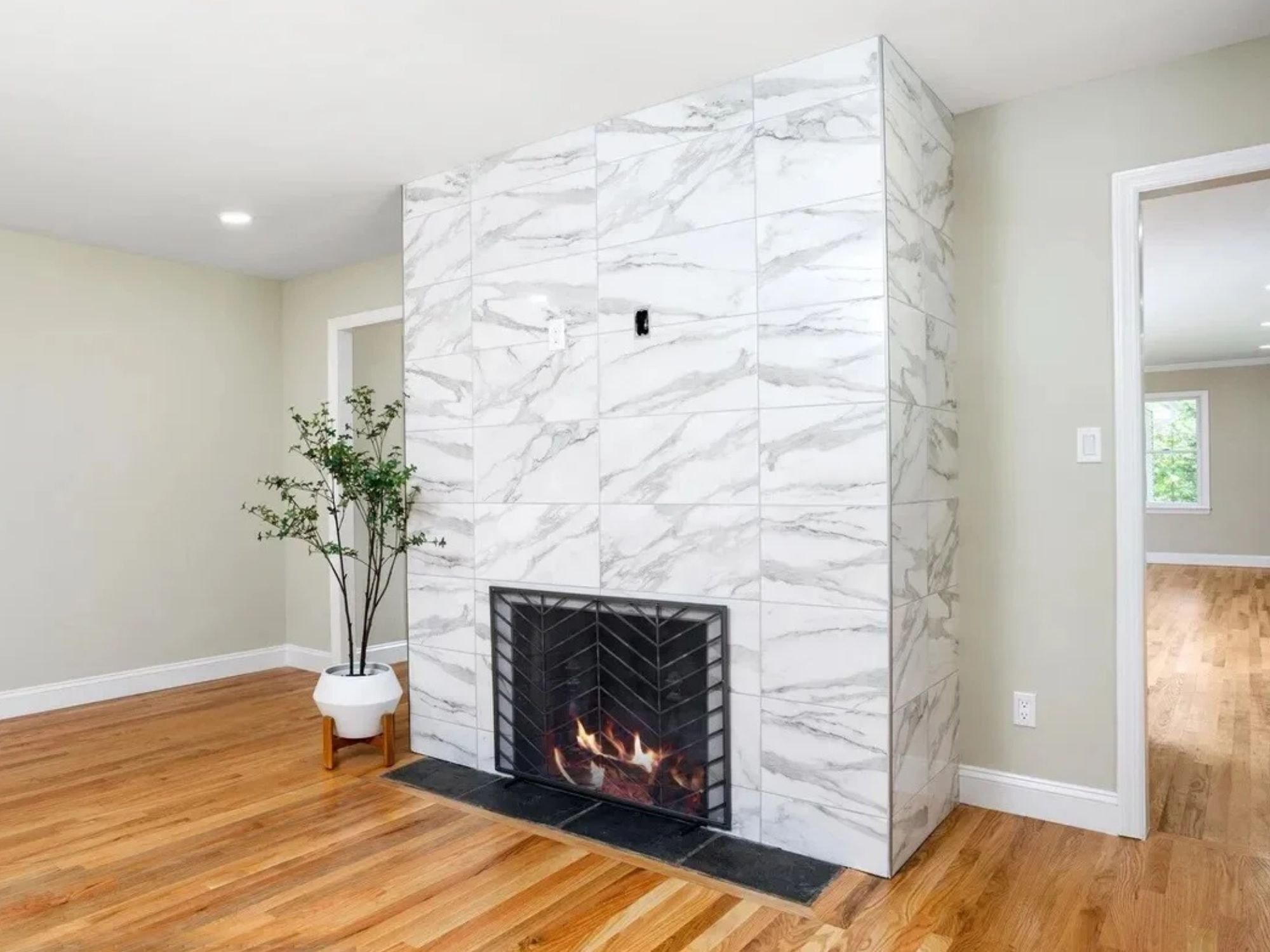 living room with marble tile fireplace surround in a houghton contracting custom home project in trenton new jersey