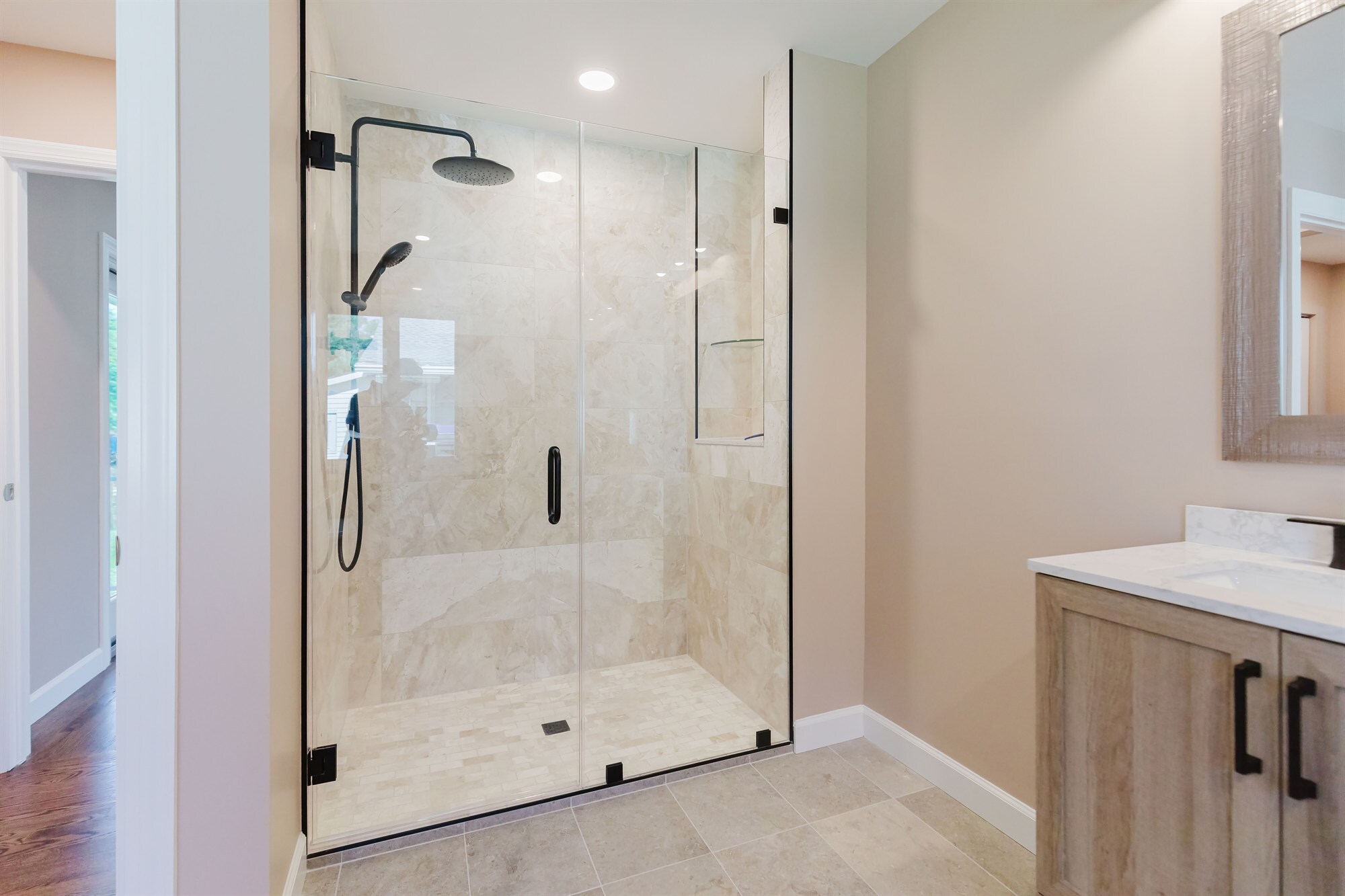 marble tile walk in shower with rainfall head and wood vanity home addition project by houghton contracting in lawrenceville new jersey-optimized