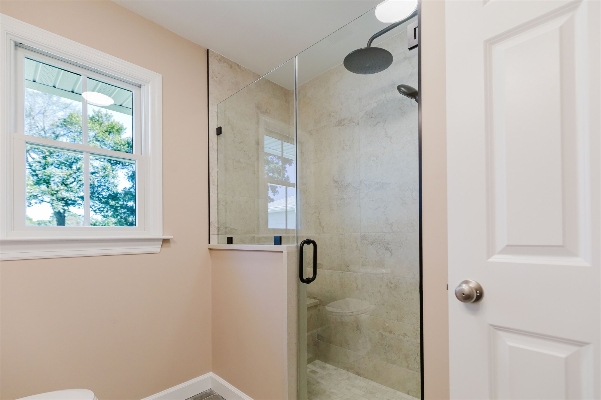 beige tile walk in shower with black rainfall head home addition project by houghton contracting in lawrenceville new jersey-optimized - Copy